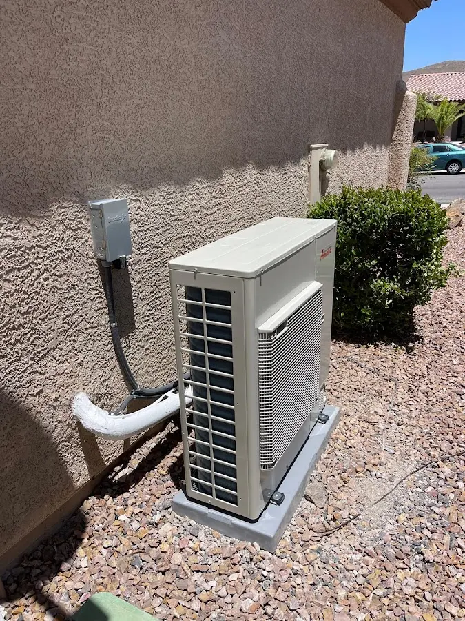 Residential air conditioning condenser unit in Estelle
